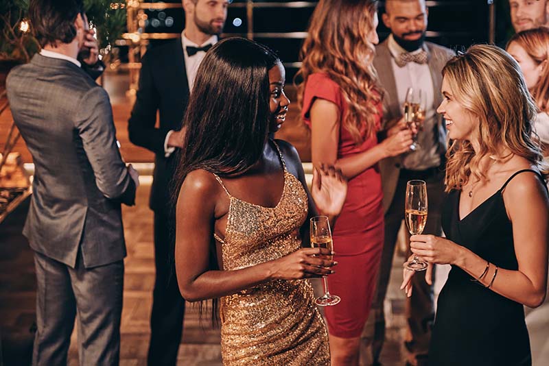 Guests gathered at a styled corporate event with warm lighting