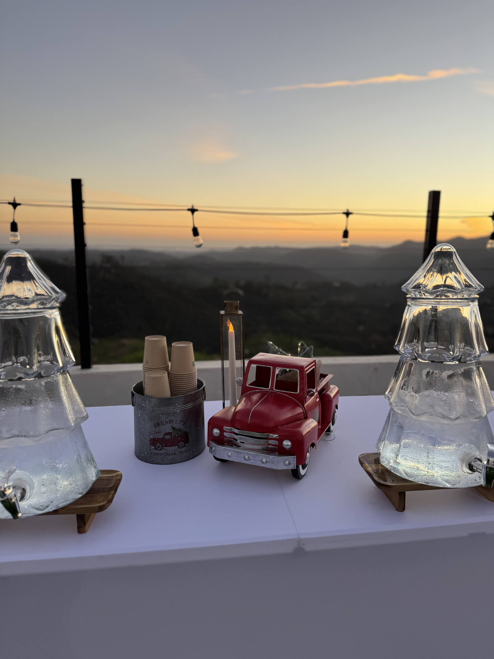 Styled water station with seasonal touches at a holiday party